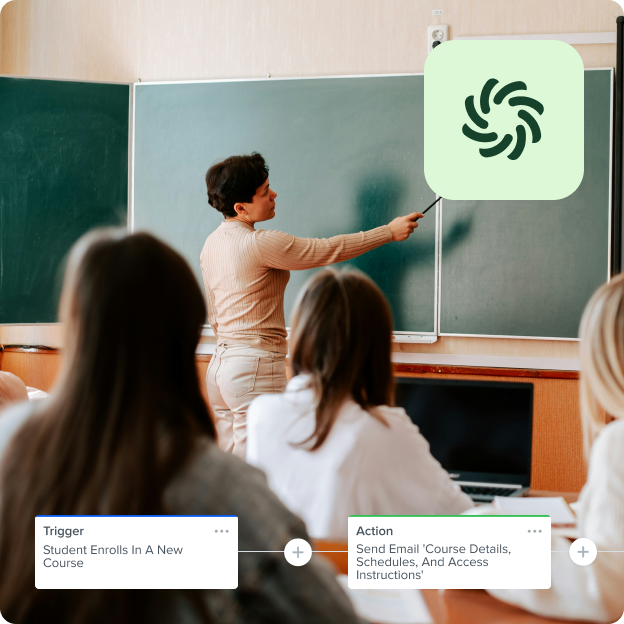 Teacher pointing at chalkboard with workflow to email course details when a student enrolls